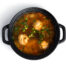 Soup with meatballsi n a black pot isolated on a white background. High quality photo